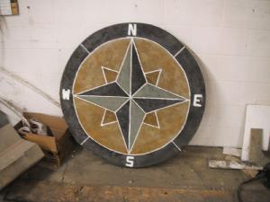 Decorative concrete compass inlay for driveway