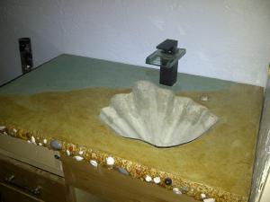 Seashell ocean themed concrete countertop vanity