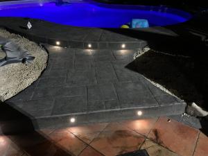 swimming pool edge light stamped concrete