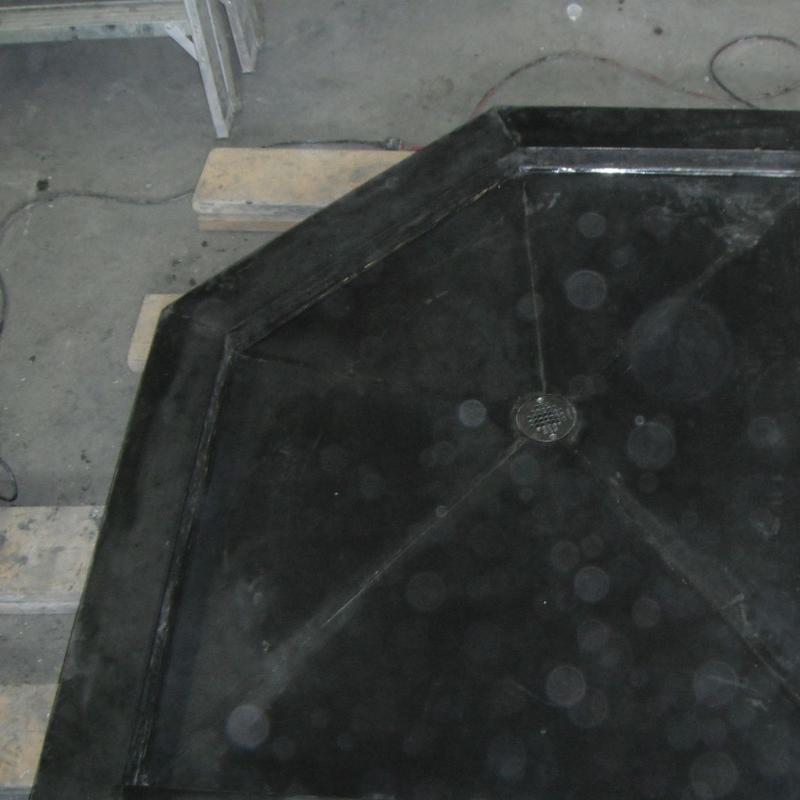 Black concrete shower drain