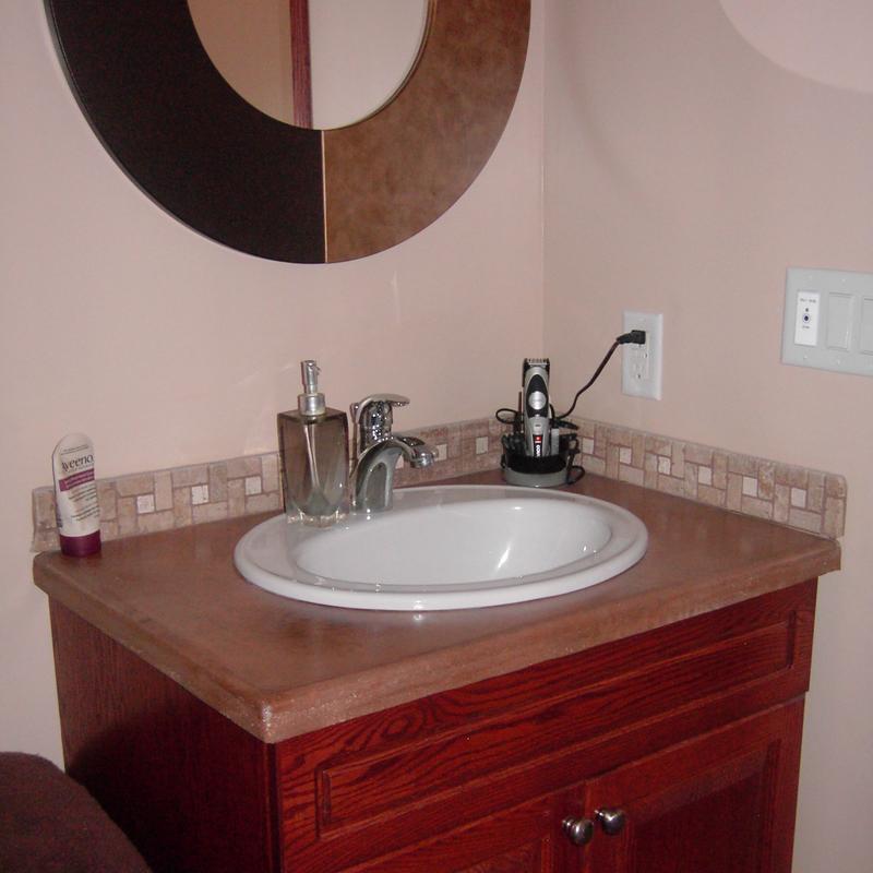Concrete vanity with drop-in sink