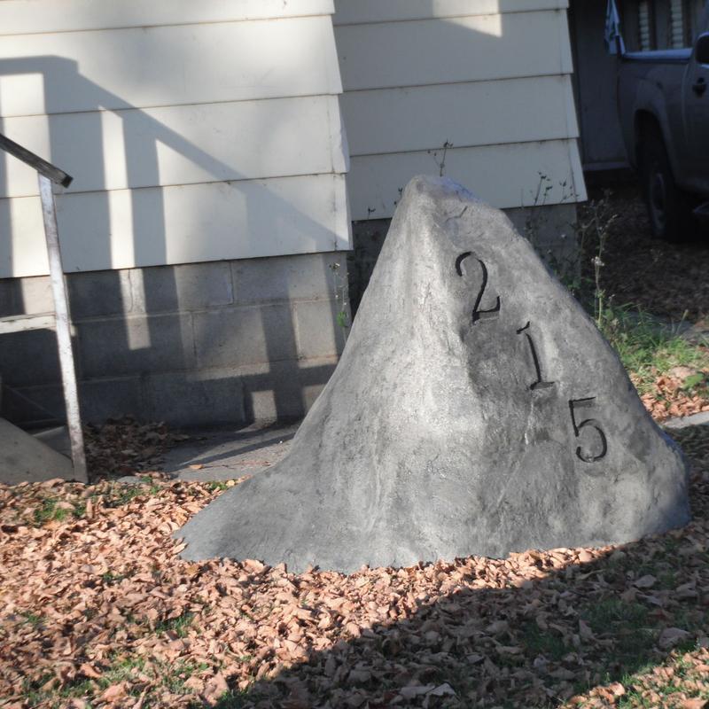 Fake concrete rock with house number
