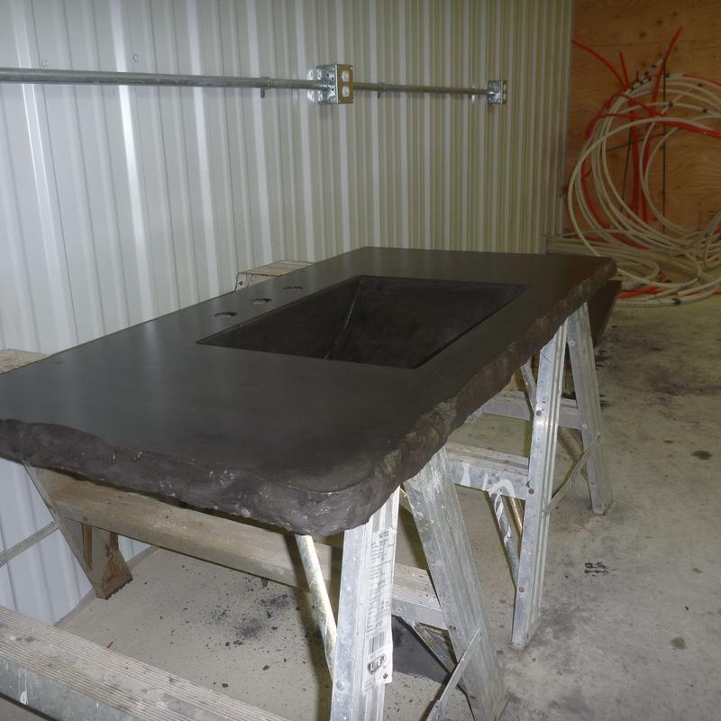 Vanity with broken edge and integral sink