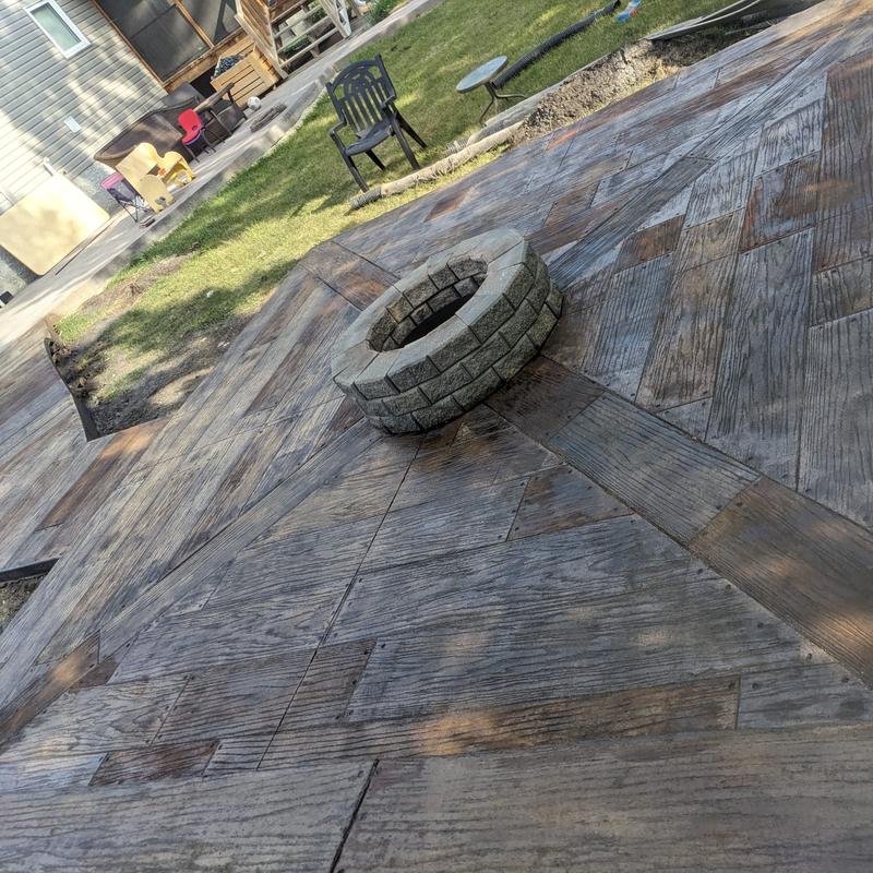 Wood plank firepit with nail hole details