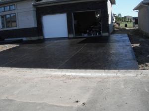 Dark stamped driveway decorative concrete