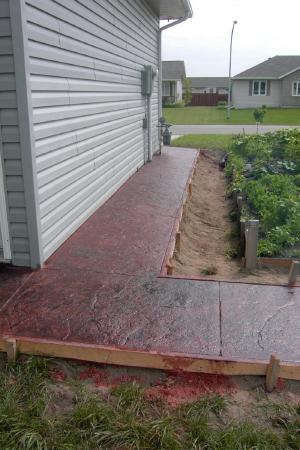 Red stamped decorative concrete sidewalk