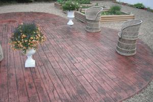 Wood plank decorative concrete stamped backyard